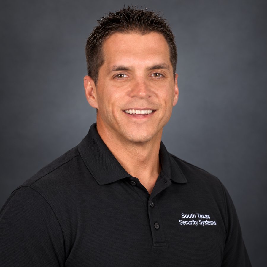 Curtis, owner of South Texas Security Systems, in his company polo